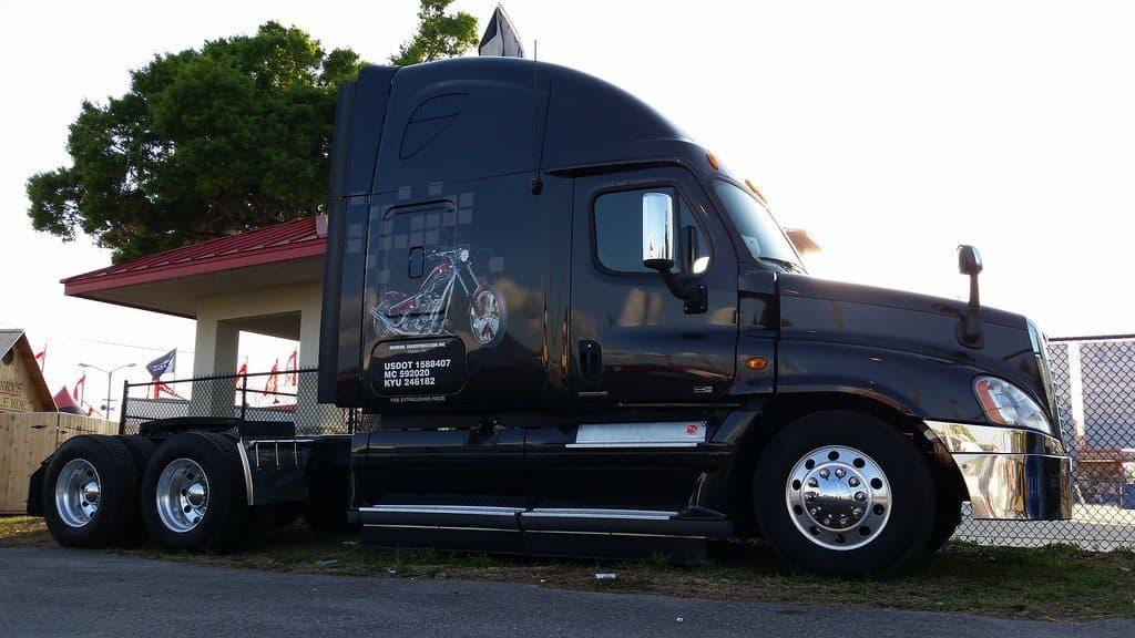 Black Freightliner Cascadia parked